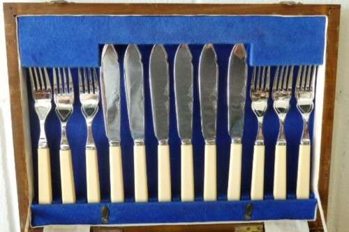 A wonderful vintage 52 piece cutlery set in a stunning vintage 3-division wooden canteen