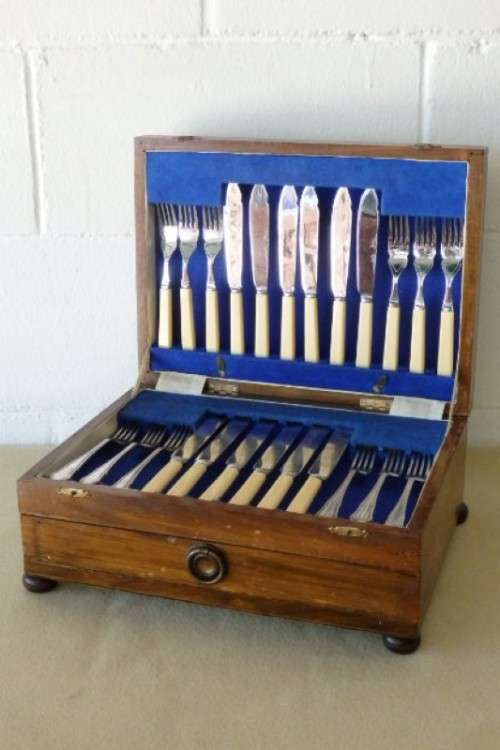 A wonderful vintage 52 piece cutlery set in a stunning vintage 3-division wooden canteen