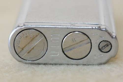 A superb original "Win Battery Electric" cigarette lighter with pouch in its original case