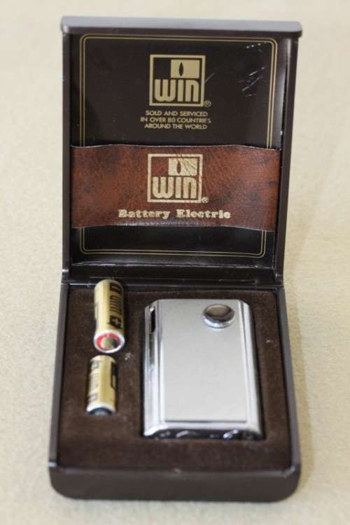 A superb original "Win Battery Electric" cigarette lighter with pouch in its original case