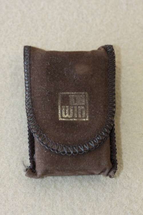 A superb original "Win Battery Electric" cigarette lighter with pouch in its original case