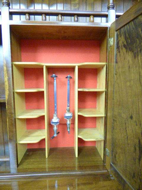 A magnificent walnut buffet cabinet w/ optics and 15 bottle wine rack. Magnificent quality!!!
