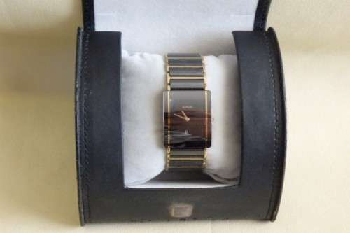 A superb gents Swiss made Rado "DiaStar" black ceramic & gold quartz watch with date display