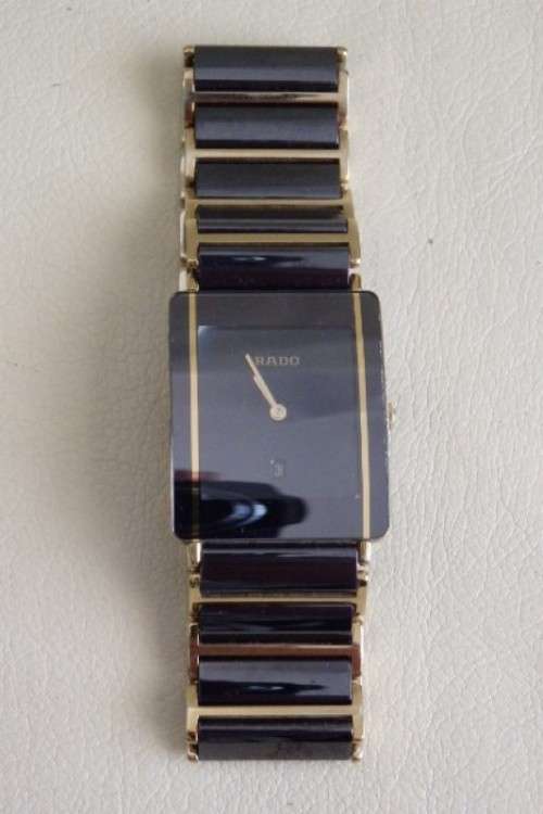 A superb gents Swiss made Rado "DiaStar" black ceramic & gold quartz watch with date display