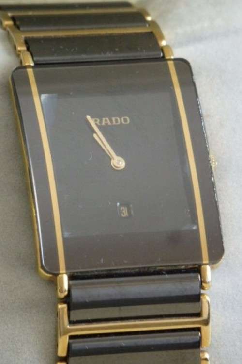 A superb gents Swiss made Rado "DiaStar" black ceramic & gold quartz watch with date display