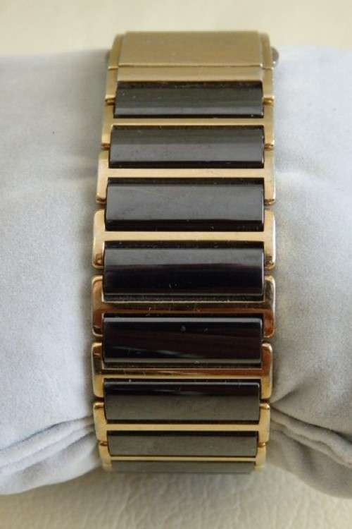 A superb gents Swiss made Rado "DiaStar" black ceramic & gold quartz watch with date display