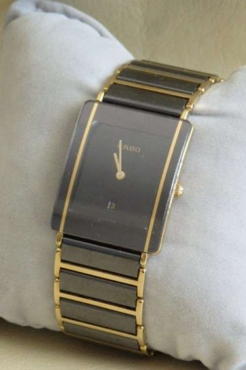 A superb gents Swiss made Rado "DiaStar" black ceramic & gold quartz watch with date display