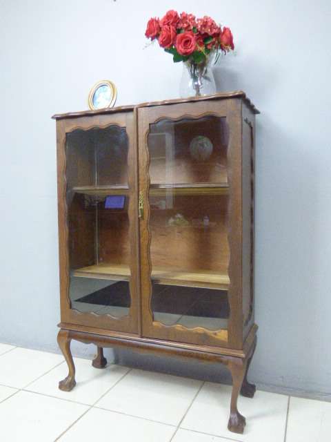 An exquisite vintage solid Imbuia glass door ball and claw showcase w shelves. Absolutely beautiful