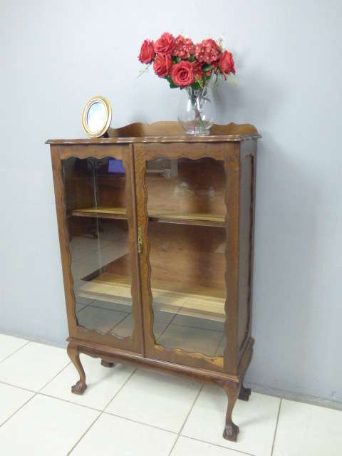 An exquisite vintage solid Imbuia glass door ball and claw showcase w shelves. Absolutely beautiful
