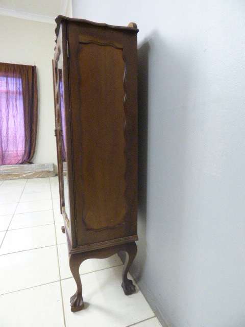 An exquisite vintage solid Imbuia glass door ball and claw showcase w shelves. Absolutely beautiful