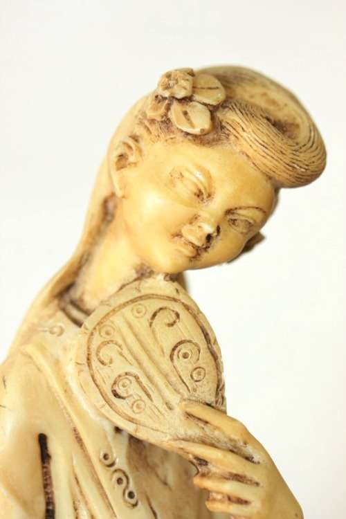 A lovely oxylite figurine of a Chinese lady in remarkable condition
