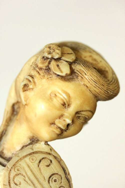 A lovely oxylite figurine of a Chinese lady in remarkable condition