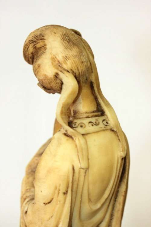 A lovely oxylite figurine of a Chinese lady in remarkable condition