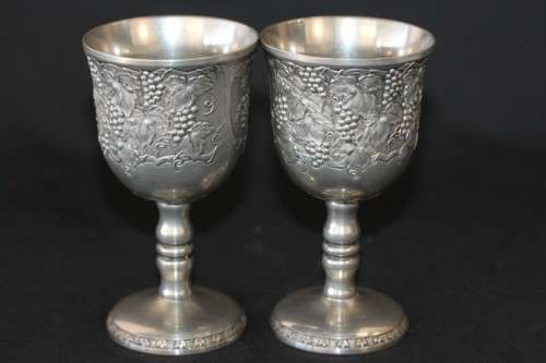 A stunning pair of silver plated (on copper) wine goblets w/ stunning detailing on them