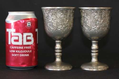A stunning pair of silver plated (on copper) wine goblets w/ stunning detailing on them