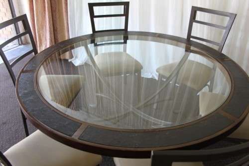 A stunning "All-Weather" patio table with bevelled glass top & 6x chairs with upholstered seats RS17