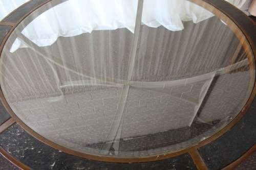 A stunning "All-Weather" patio table with bevelled glass top & 6x chairs with upholstered seats RS17