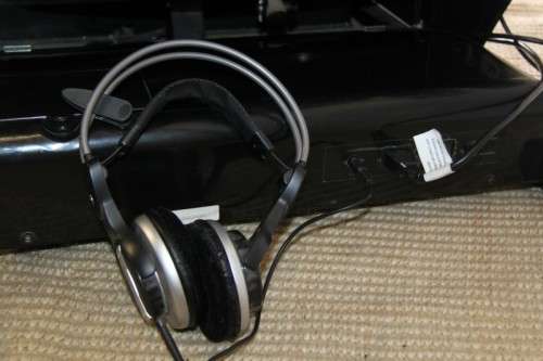 An incredible large automatic massage chair with electronic keypad and headphones