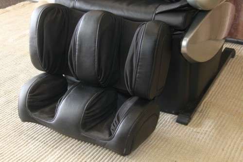 An incredible large automatic massage chair with electronic keypad and headphones
