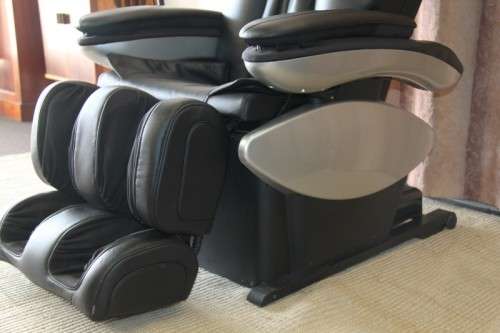 An incredible large automatic massage chair with electronic keypad and headphones