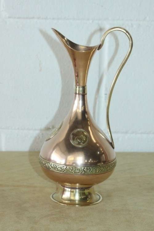 A beautiful vintage solid copper pitcher/ jug with solid brass embellishments and detailing