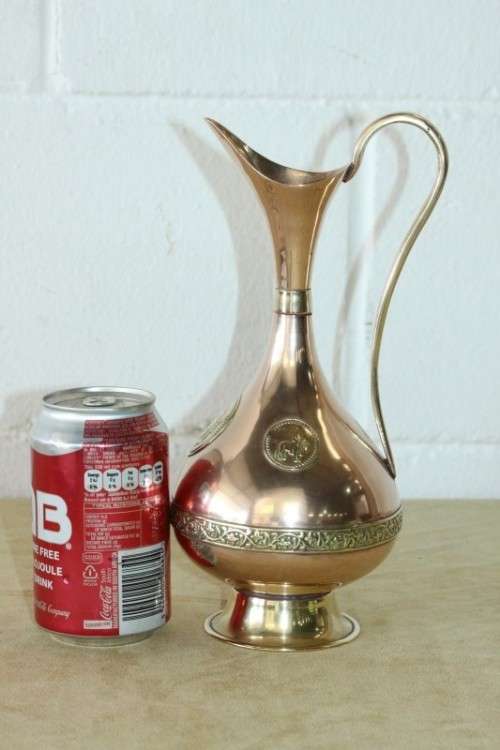 A beautiful vintage solid copper pitcher/ jug with solid brass embellishments and detailing