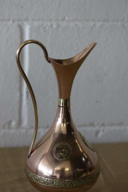 A beautiful vintage solid copper pitcher/ jug with solid brass embellishments and detailing