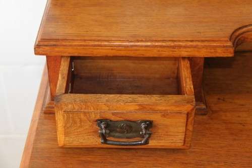 A magnificent antique solid oak dressing table w/ 6 drawers & a large beveled mirror on castors