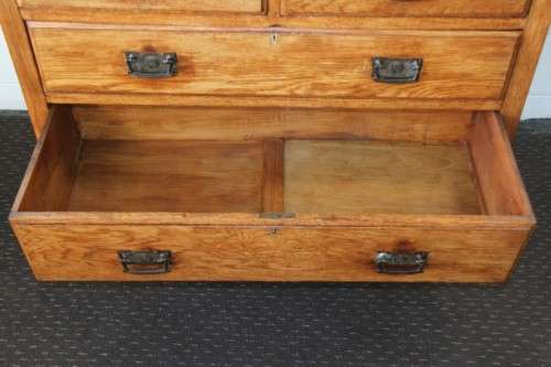 A magnificent antique solid oak dressing table w/ 6 drawers & a large beveled mirror on castors