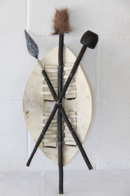 An amazing traditional Zulu cowhide shield with a spear and knobkierie