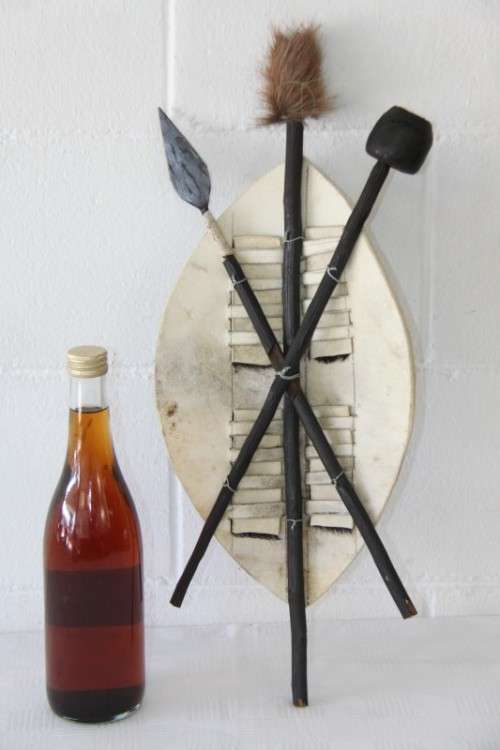 An amazing traditional Zulu cowhide shield with a spear and knobkierie