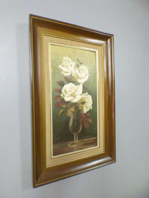 A beautiful oil painting of roses by renowned artist Rose-Mary Hacking. Stunning in home or office!!
