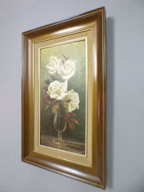 A beautiful oil painting of roses by renowned artist Rose-Mary Hacking. Stunning in home or office!!