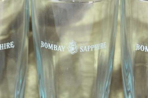 A superb set of 5x original Bombay Sapphire Gin branded glasses in mint condition; bid/glass