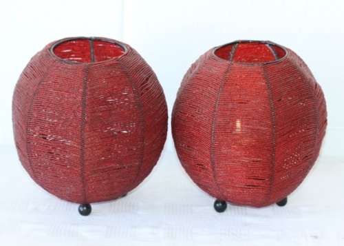 Two exquisite red beaded candle holders on a solid metal frame and metal feet; bid/holder