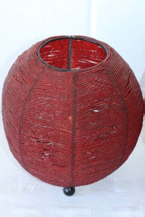 Two exquisite red beaded candle holders on a solid metal frame and metal feet; bid/holder