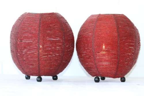 Two exquisite red beaded candle holders on a solid metal frame and metal feet; bid/holder
