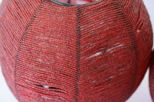 Two exquisite red beaded candle holders on a solid metal frame and metal feet; bid/holder