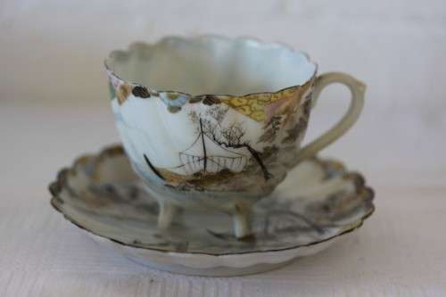 Two rare antique Japanese "translucent" porcelain teacups and saucers with amazing hand painted work