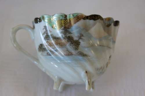 Two rare antique Japanese "translucent" porcelain teacups and saucers with amazing hand painted work