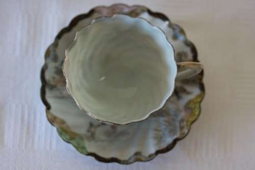 Two rare antique Japanese "translucent" porcelain teacups and saucers with amazing hand painted work