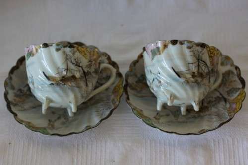 Two rare antique Japanese "translucent" porcelain teacups and saucers with amazing hand painted work