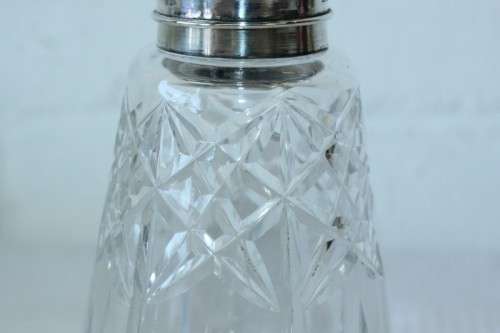 A stunning mid-century "lead cut-crystal" sugar muffineer (decanter) with a silver plated lid