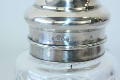 A stunning mid-century "lead cut-crystal" sugar muffineer (decanter) with a silver plated lid