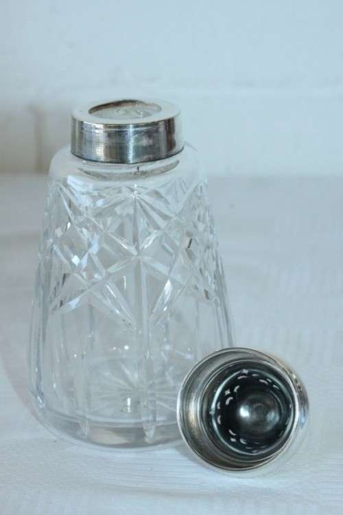 A stunning mid-century "lead cut-crystal" sugar muffineer (decanter) with a silver plated lid