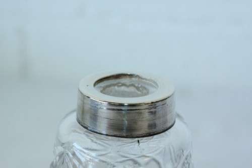 A stunning mid-century "lead cut-crystal" sugar muffineer (decanter) with a silver plated lid