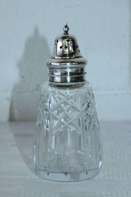 A stunning mid-century "lead cut-crystal" sugar muffineer (decanter) with a silver plated lid