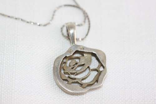 An exquisite original Jenna Clifford sterling silver "The Rose" pendant on an Italian silver chain