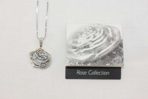 An exquisite original Jenna Clifford sterling silver "The Rose" pendant on an Italian silver chain