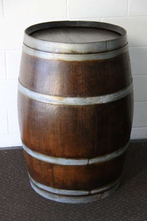 An incredible original solid French oak wine barrel with its original hoops in great condition